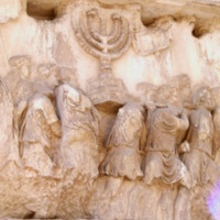 Carrying_off_the_Menorah_from_the_Temple_in_Jerusalem_depicted_on_a_frieze_on_the_Arch_of_Titus_in_the_Forum_Romanum.JPG