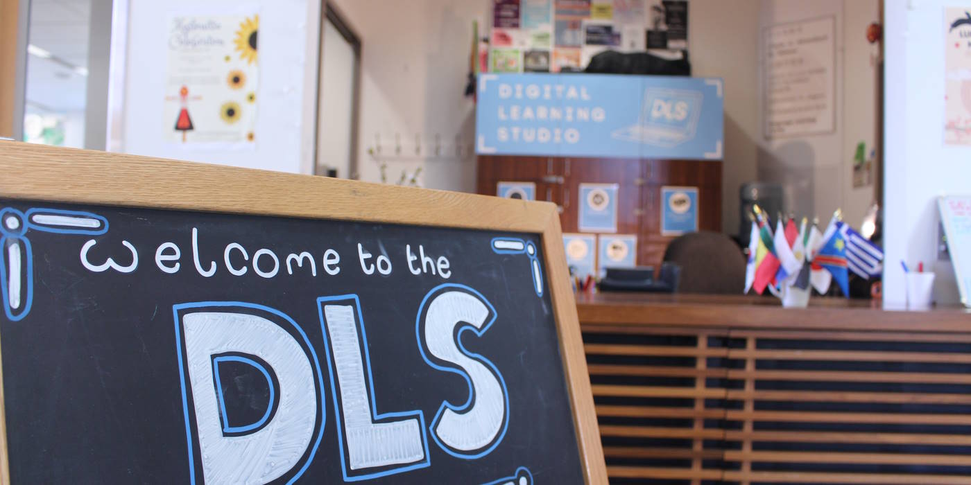 The DLS welcome sign and desk